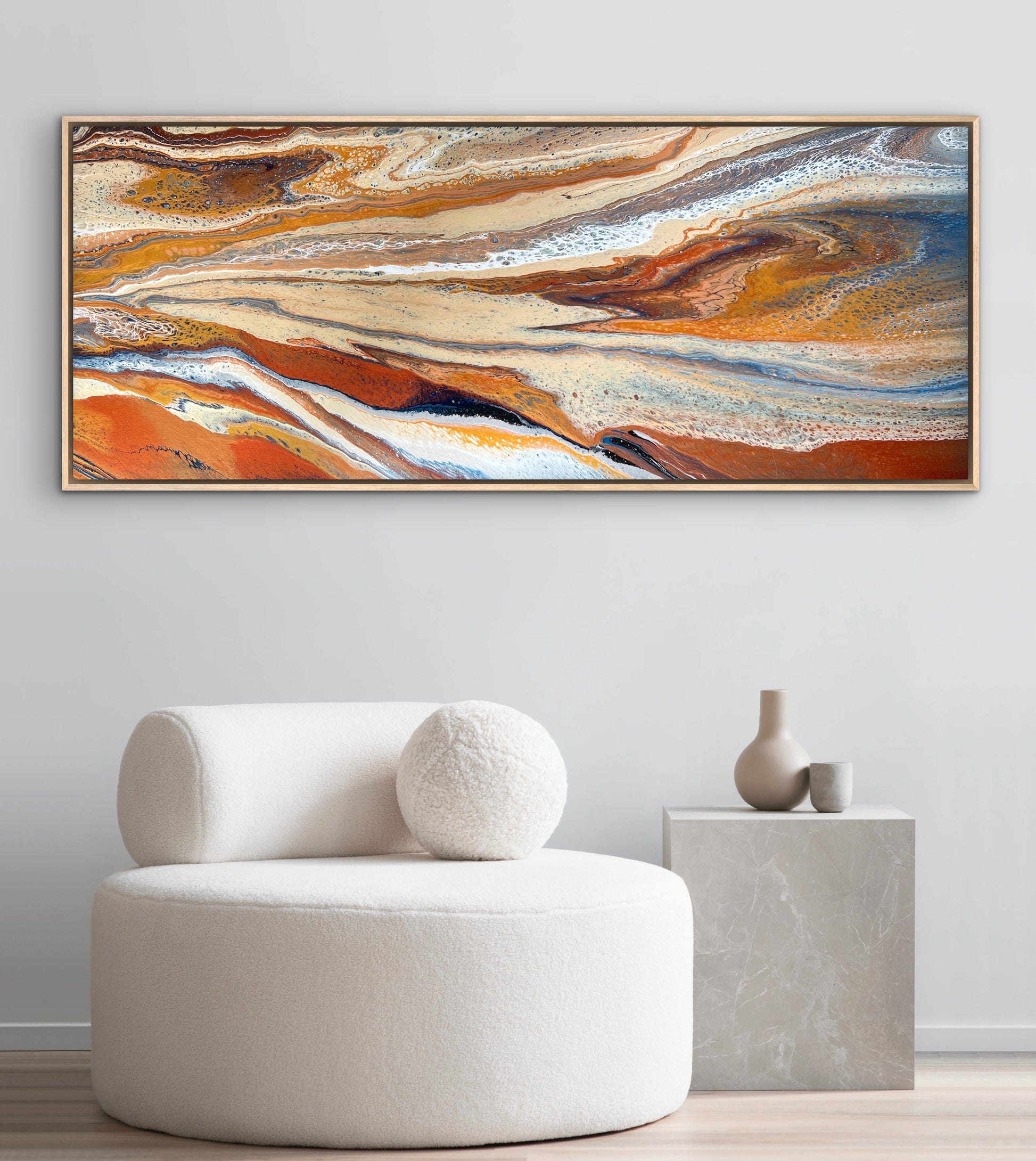 Desert Drift horizontal abstract painting displayed above a white lounge chair in a minimalist neutral interior