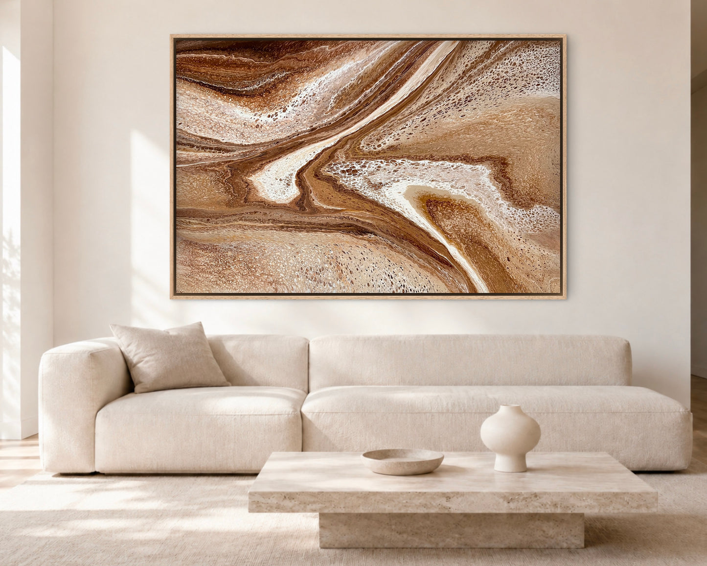 Restless Terrain modern brown abstract painting displayed above a cream sofa in a bright contemporary living room
