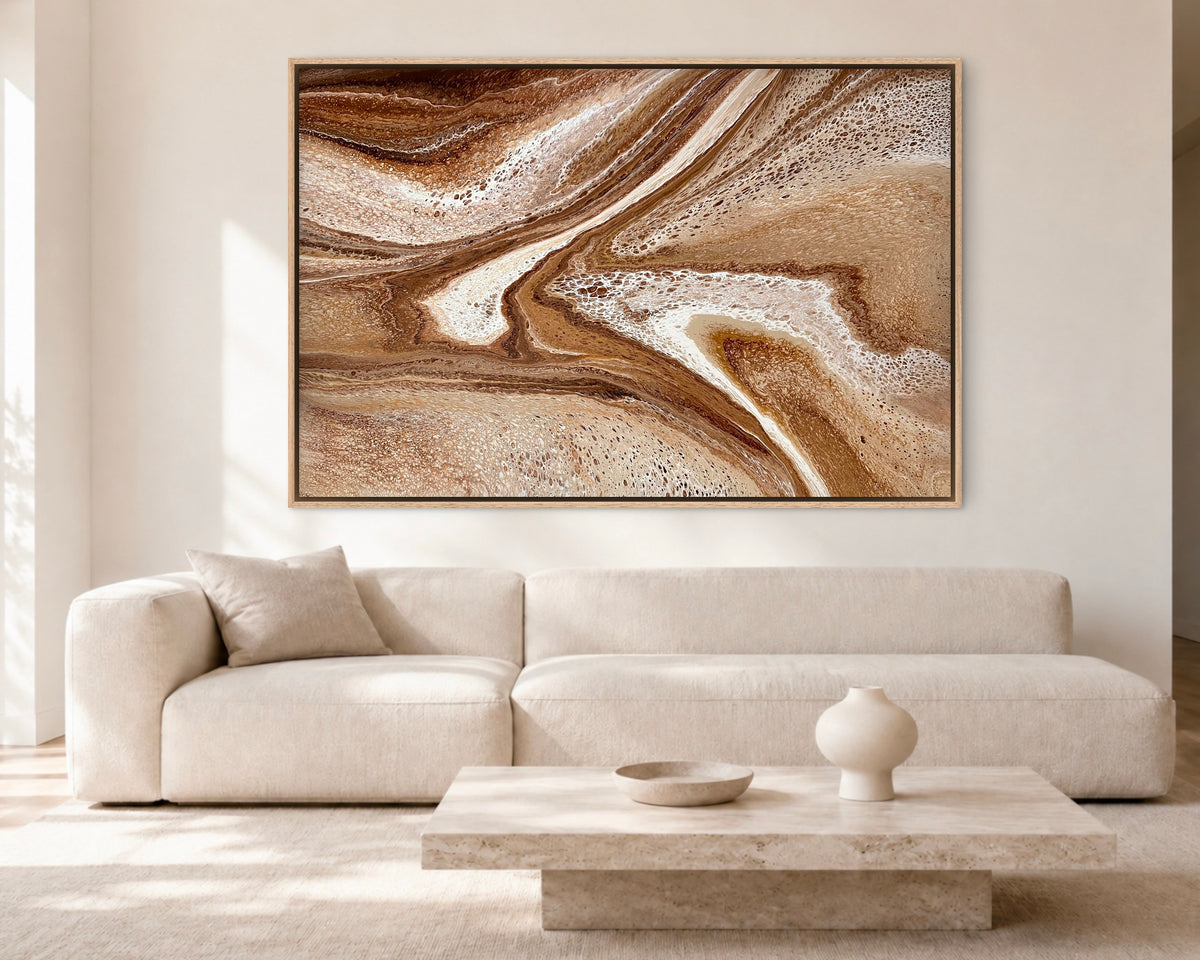 Restless Terrain modern brown abstract painting displayed above a cream sofa in a bright contemporary living room
