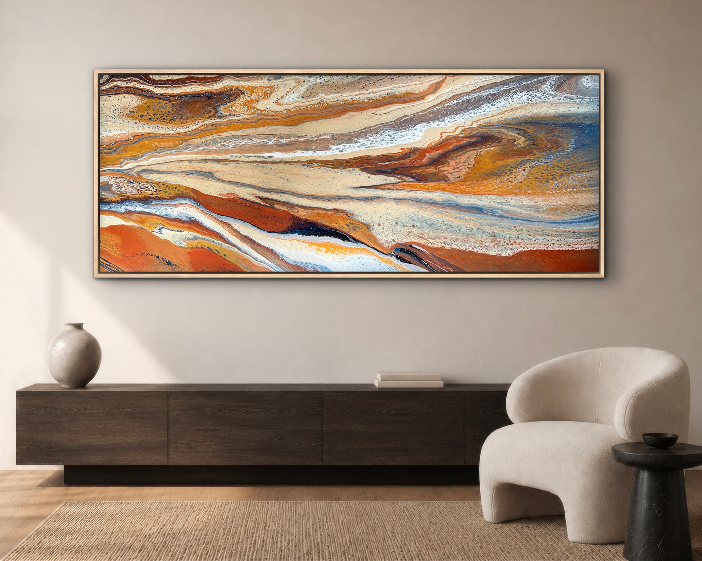 Desert Drift wide statement painting in burnt orange, cream and blue, styled above a dark timber sideboard in a warm modern living room