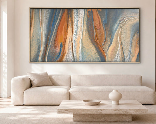 Exposed Shores oversized original abstract painting in coastal blue, copper, sand and cream, displayed above a white sofa in a contemporary living room
