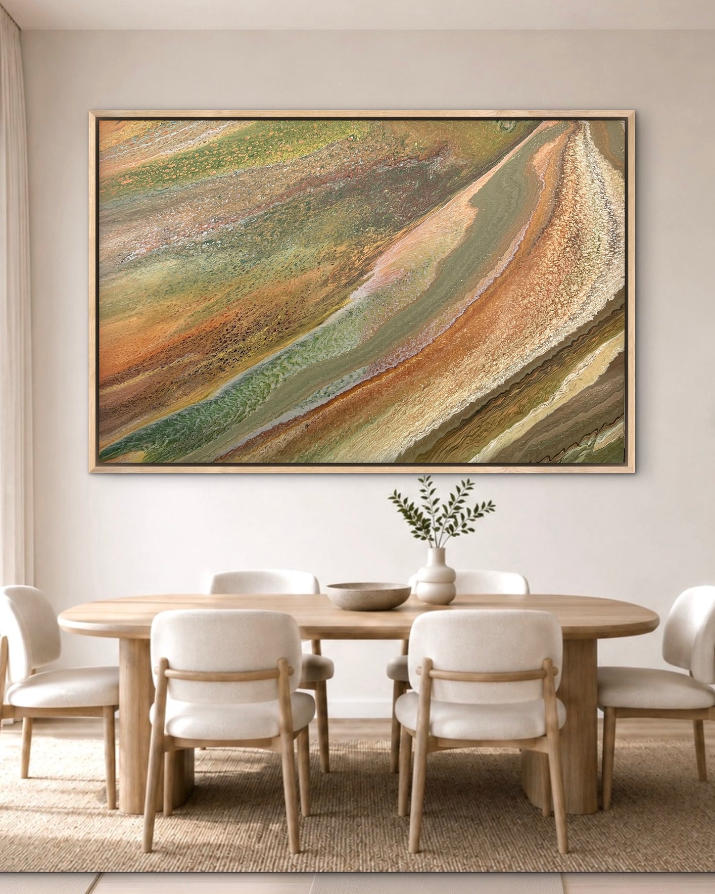 Grounded Light large green and gold abstract artwork displayed in an oak frame above a round timber table in a bright organic-modern dining room