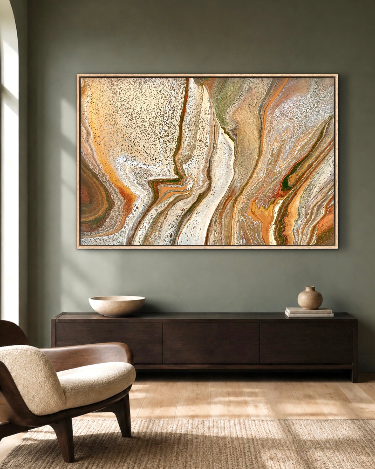 Mineral Divide original earth-tone artwork in cream, bronze and olive, displayed above a dark timber console against a deep green wall