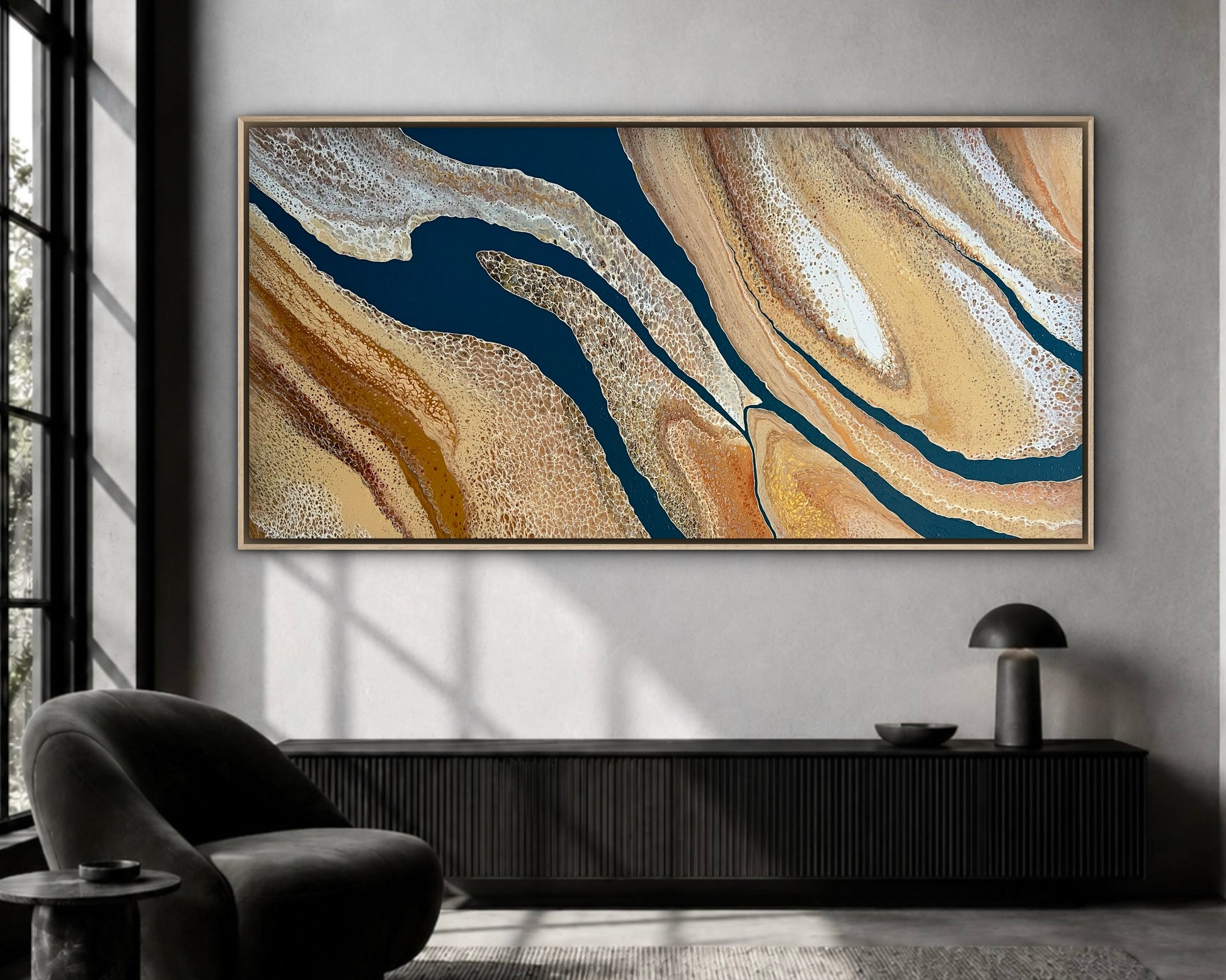 Rivers Divide extra-large original navy and gold textured abstract painting displayed above a black console in a dramatic contemporary living room