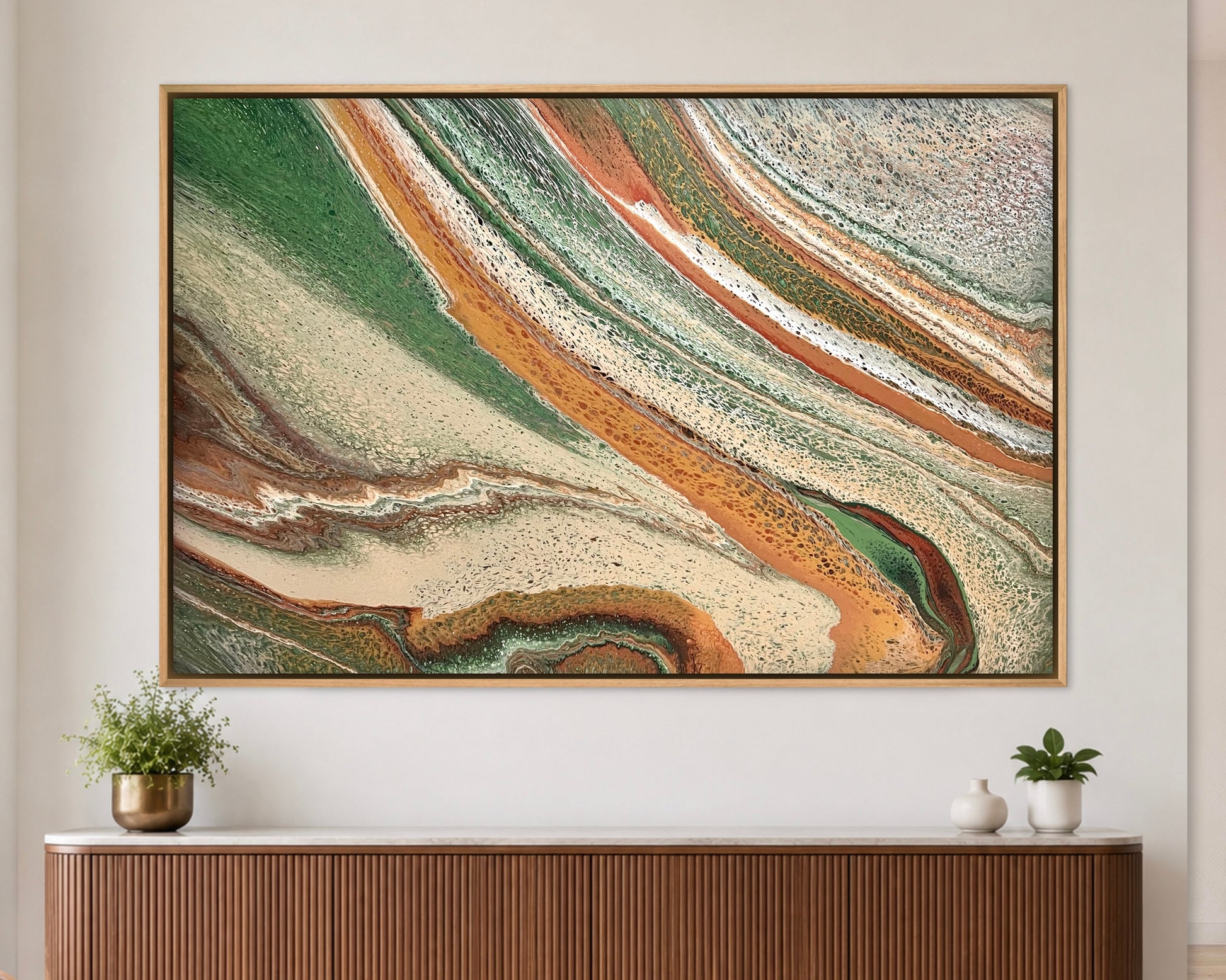 Sculpted Plains green and terracotta abstract landscape painting styled above a ribbed timber console

